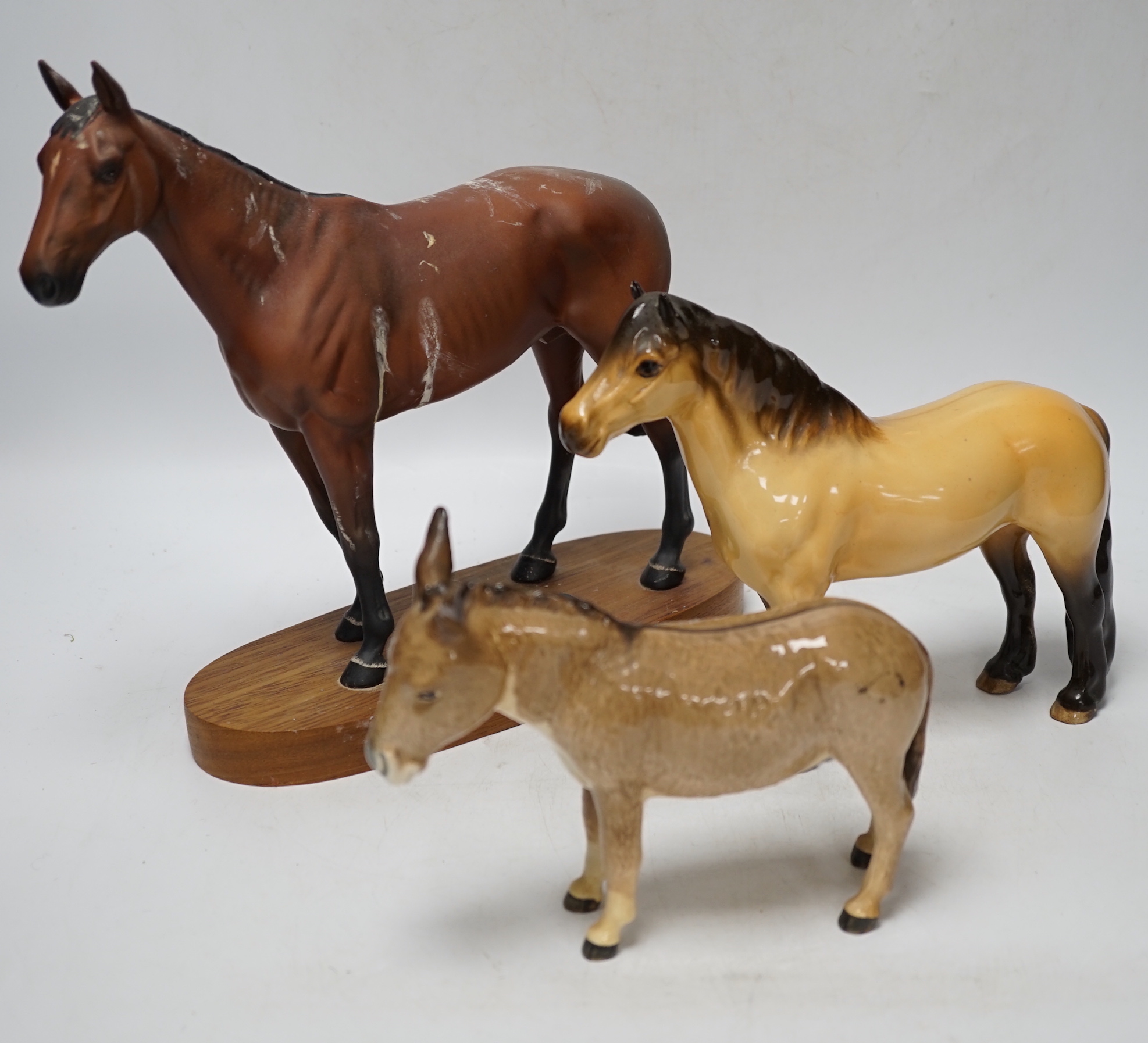 Five Beswick horses including a huntsman on a grey and Palomino pony with boy rider, huntsman 20.5cm high, (8)